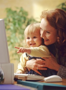 Mom and child having fun on the computer